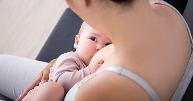 Mother reacts to criticism over photo of breastfeeding toddler.