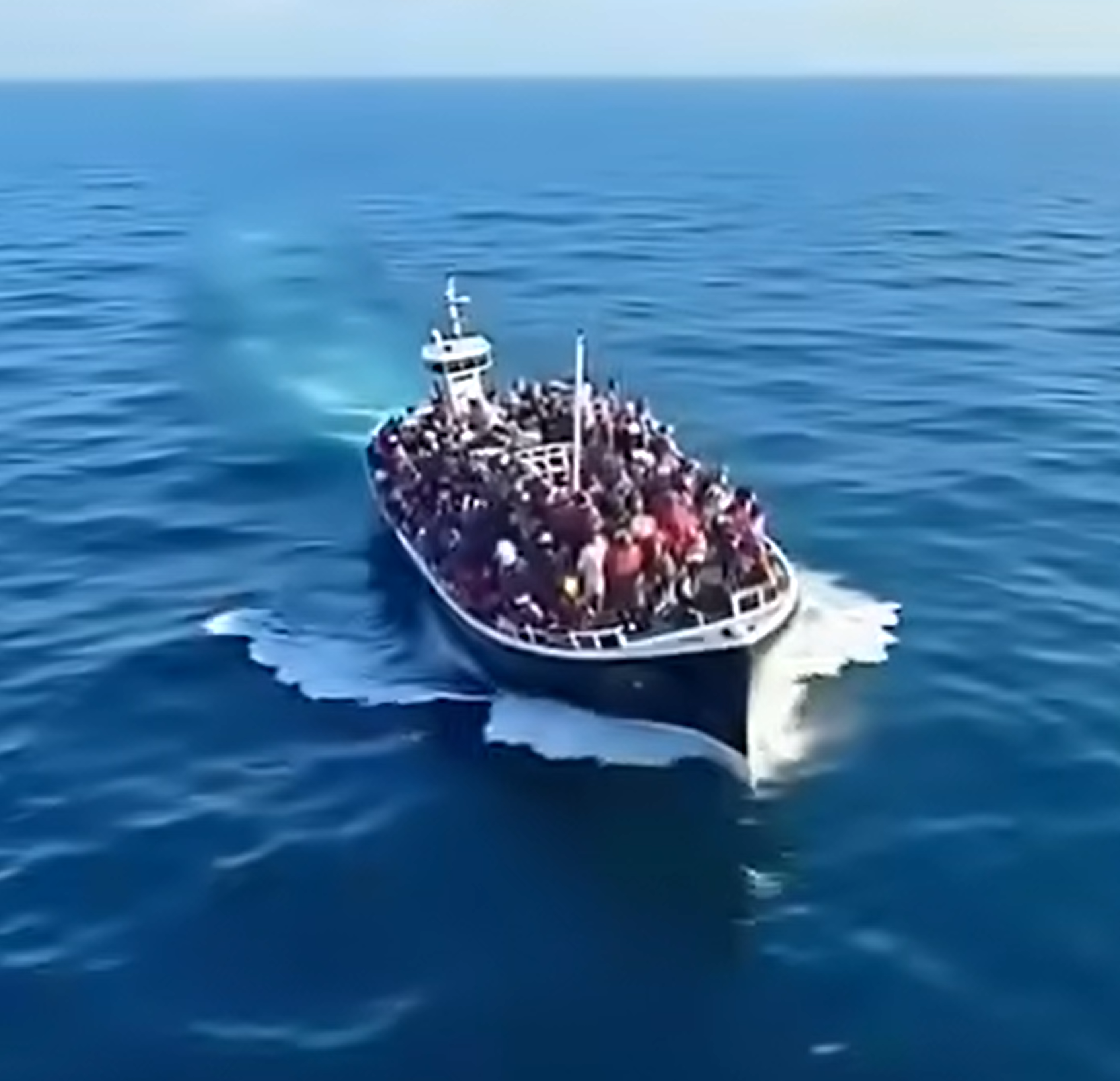 Dozens of migrants on overcrowded rubber boat rescued at sea